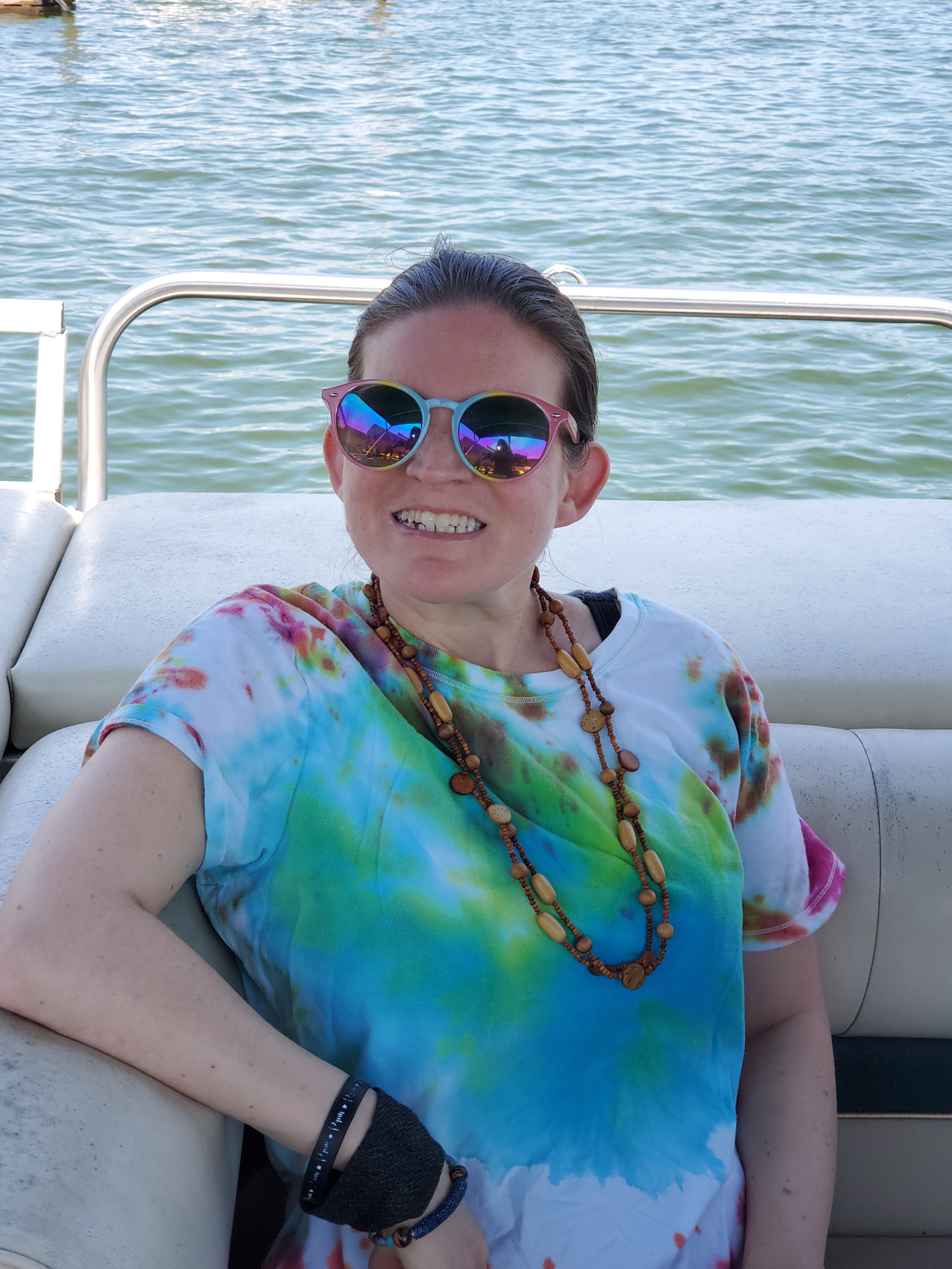 Gabriel Homes resident on a boat at a lake.