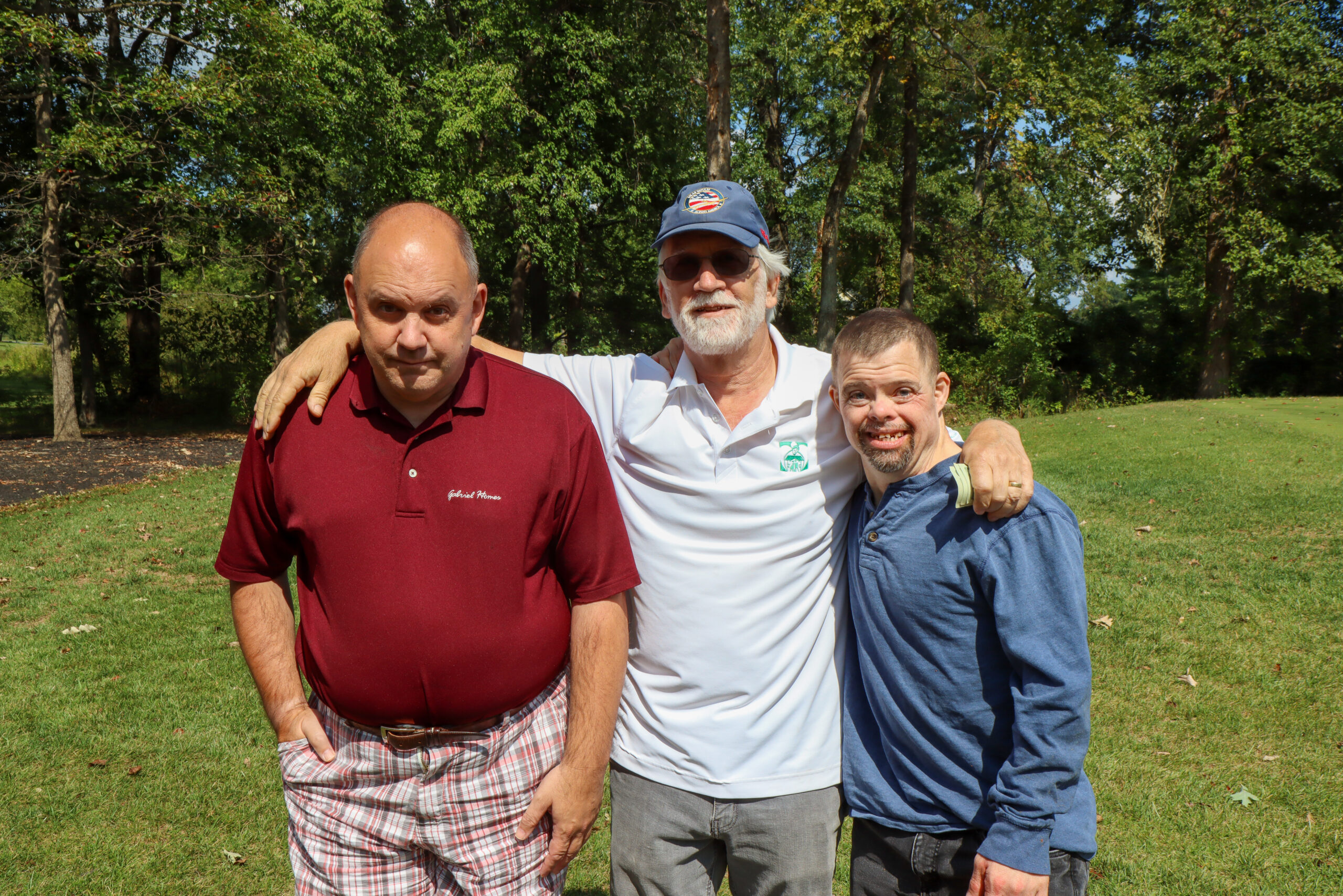 Gabriel Homes Board Member Gary (center) with two residents.