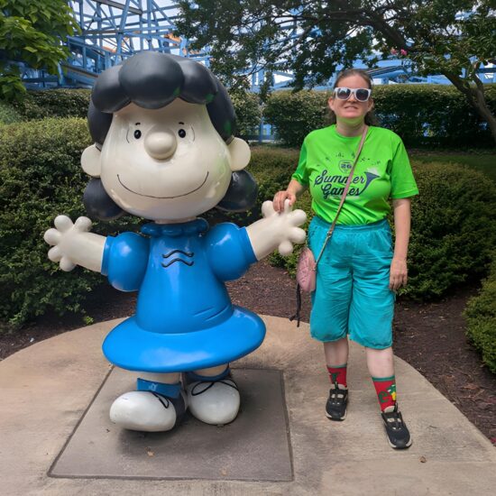 Gabriel Homes resident posing with Lucy at Kings Dominion.