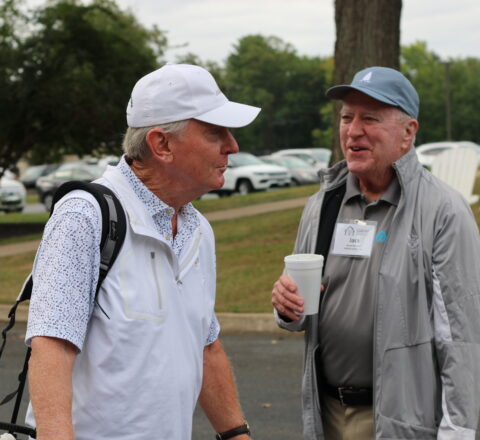 Gabriel Homes Board Member Jack Mannion (right) with golf tournament attendee.