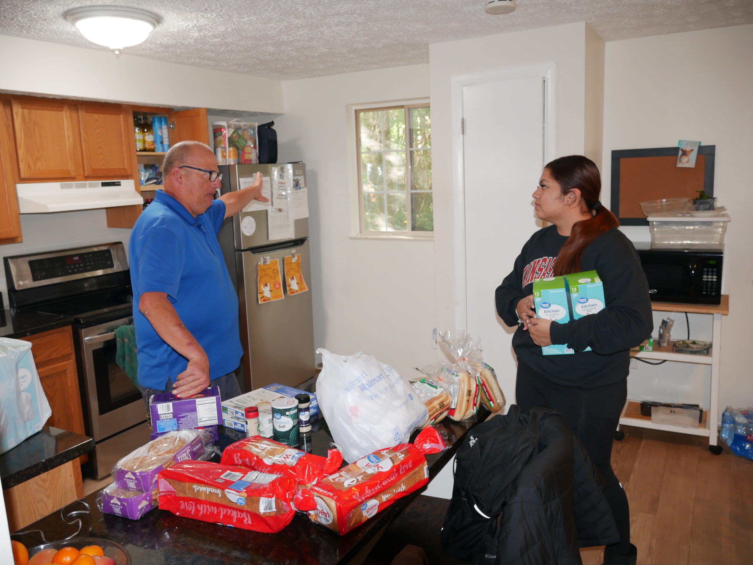 Angela Rivera (right), with resident at Gabriel Homes (left).