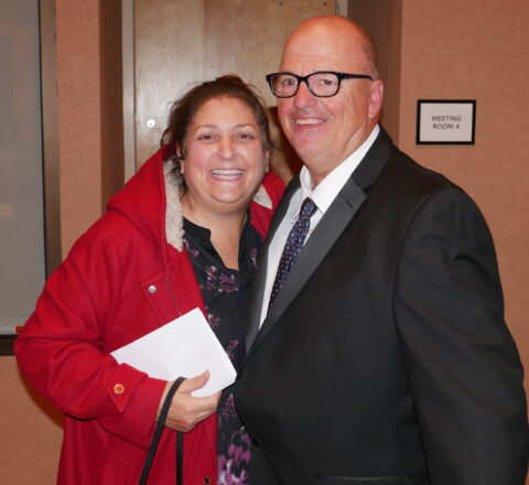 Gabriel Homes Board of Directors Chair Michele Bolos (left) with a resident (right).