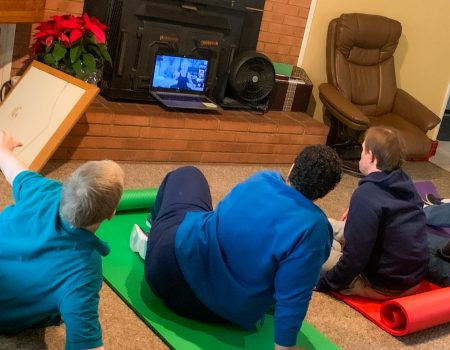 Gabriel Homes residents who have IDD participating in a Zoom yoga exercise session.