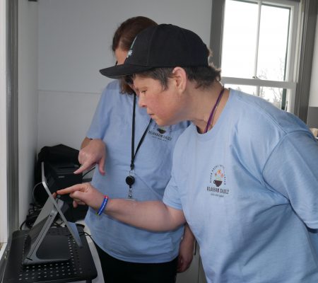 Gabriel Homes resident preparing coffee for customer.