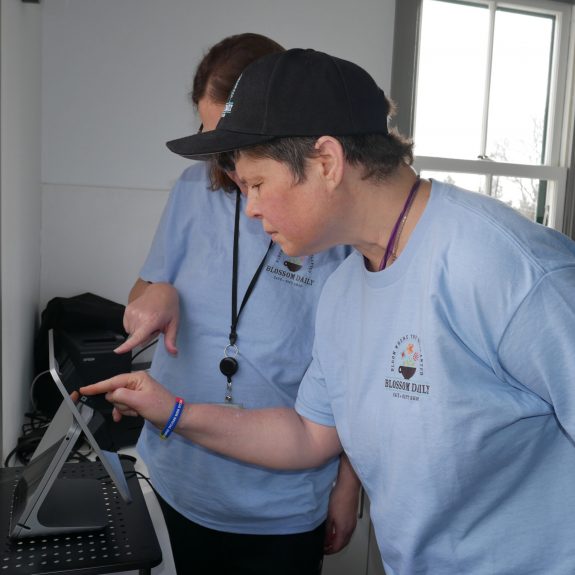 Gabriel Homes resident preparing coffee for customer.