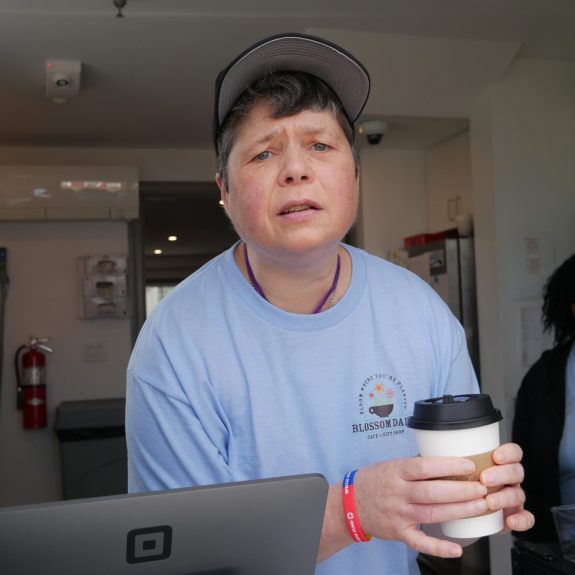 Gabriel Homes resident serving coffee at her new job in the new year.