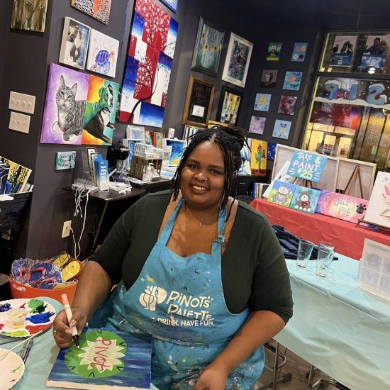 Gwen Murugu, director of residential services, at an art-based teambuilding event.