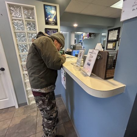 Gabriel Homes resident checking in at the dentist's in Reston.