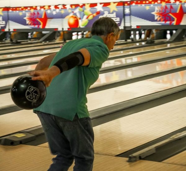 Friend of Gabriel Homes resident bowling. The sport tests players mentally and physically.