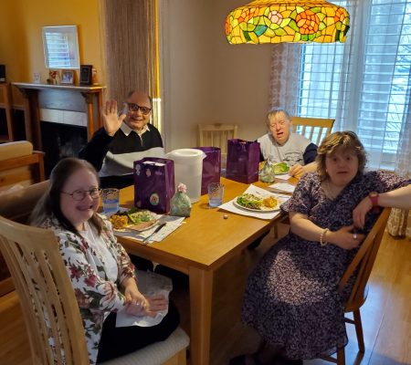 Gabriel Homes residents sitting around the table for an Easter dinner.