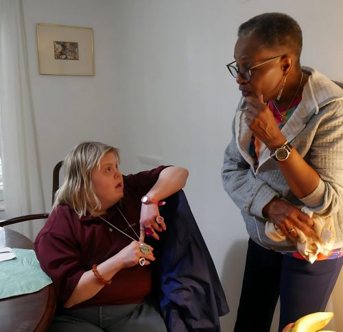 Gabriel Homes resident (left) having a conversation with a residential counselor (right.)