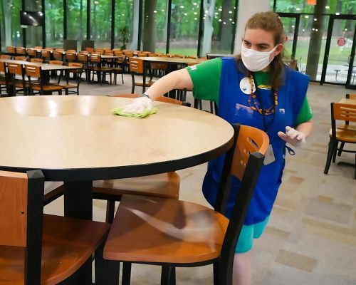 Gabriel Homes resident cleaning cafeteria for work.