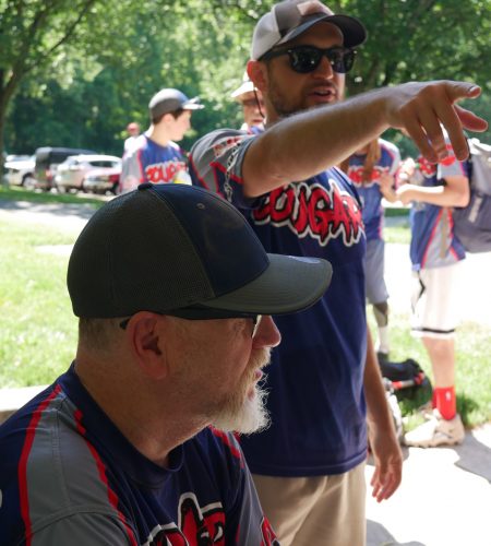 Special Olympics coach (back) with Gabriel Homes resident (front).