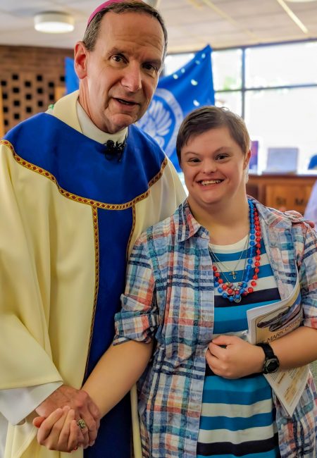 Sarah, a resident at Gabriel Homes, meeting the Archbishop.