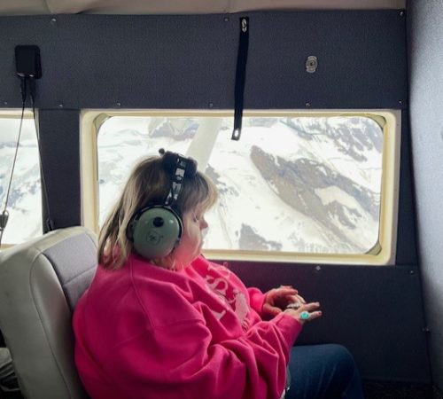 Gabriel Homes resident on helicopter in Alaska.