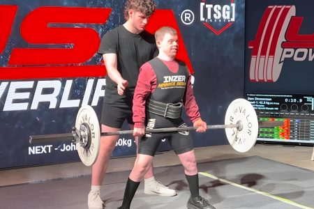 Gabriel Homes resident powerlifting at tournament.